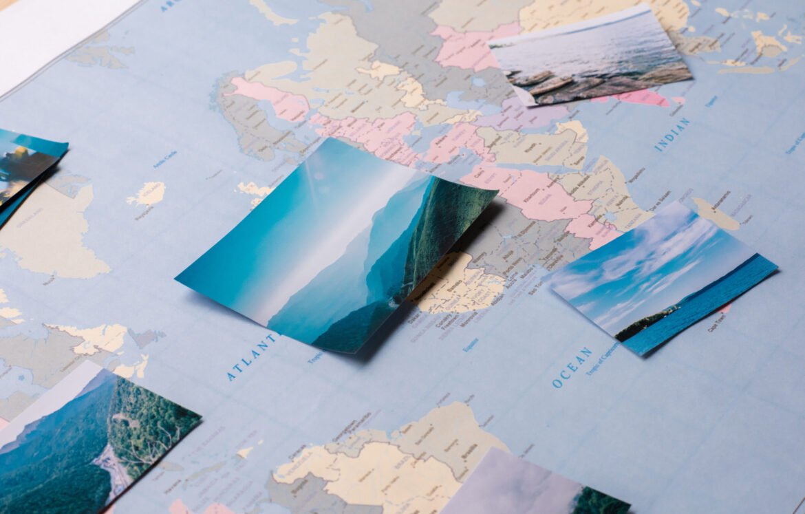 Close-up of beautiful remarkable places marked on world map, preparing for trip concept