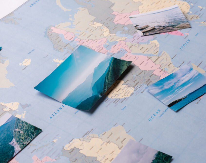 Close-up of beautiful remarkable places marked on world map, preparing for trip concept
