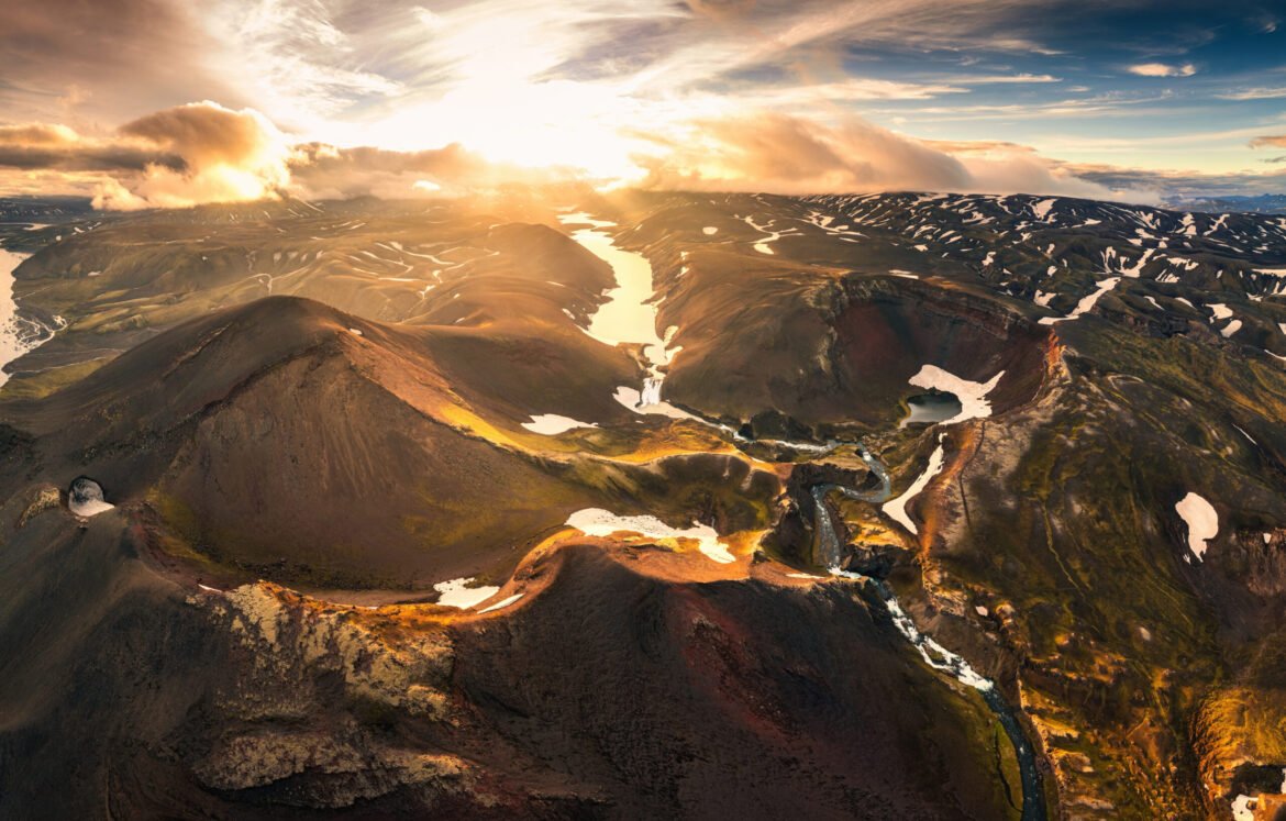 Aerial view of sunset over mysterious volcanic crater and glacie Aerial drone view of sunset over mysterious volcanic crater and glacier stretches through the central highlands of iceland on summer. Rauoibotn, Torfajokull and Myrdalsjokull glaciers
