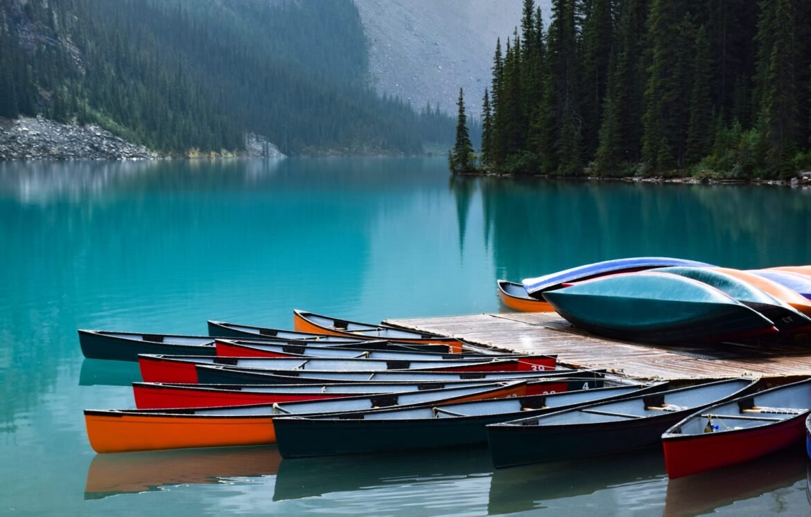 colorful-canoe-lined-up-on-turquoise-blue-water-mo-2025-03-12-22-39-34-utc