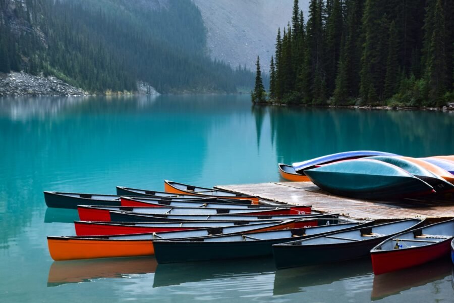 colorful-canoe-lined-up-on-turquoise-blue-water-mo-2025-03-12-22-39-34-utc