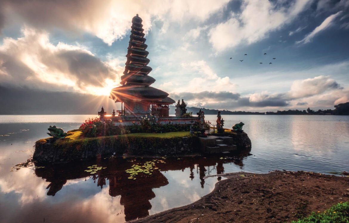 Sunrise shining on ancient temple of Pura Ulun Danu Bratan on Br Sunrise shining on ancient temple of Pura Ulun Danu Bratan on Bratan Lake at Bali, Indonesia