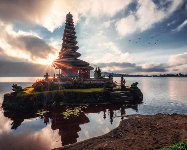 Sunrise shining on ancient temple of Pura Ulun Danu Bratan on Bratan Lake at Bali, Indonesia