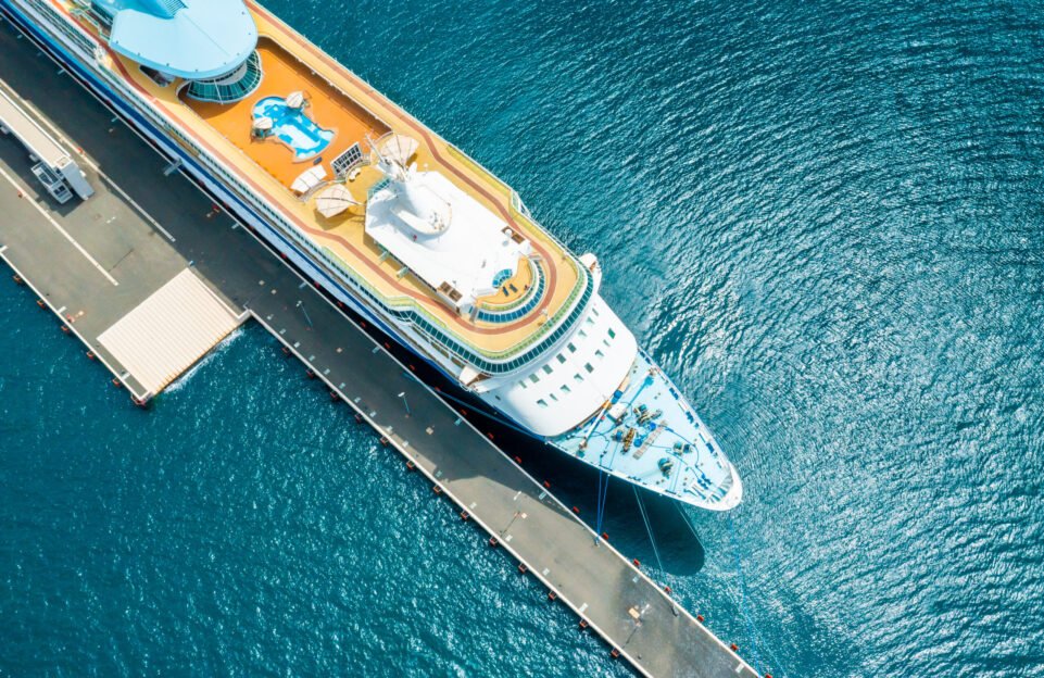 Top view of a large cruise liner ship with swimming pool moored in marina of Adriatic sea