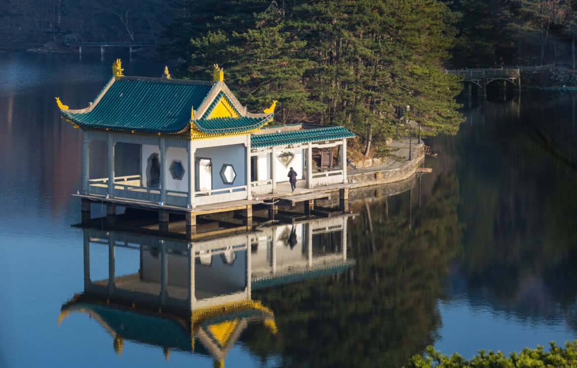traditional pavilion at dusk on lushan mountain traditional pavilion at dusk on lake, lushan mountain landscape closeup, jiangxi province, China.