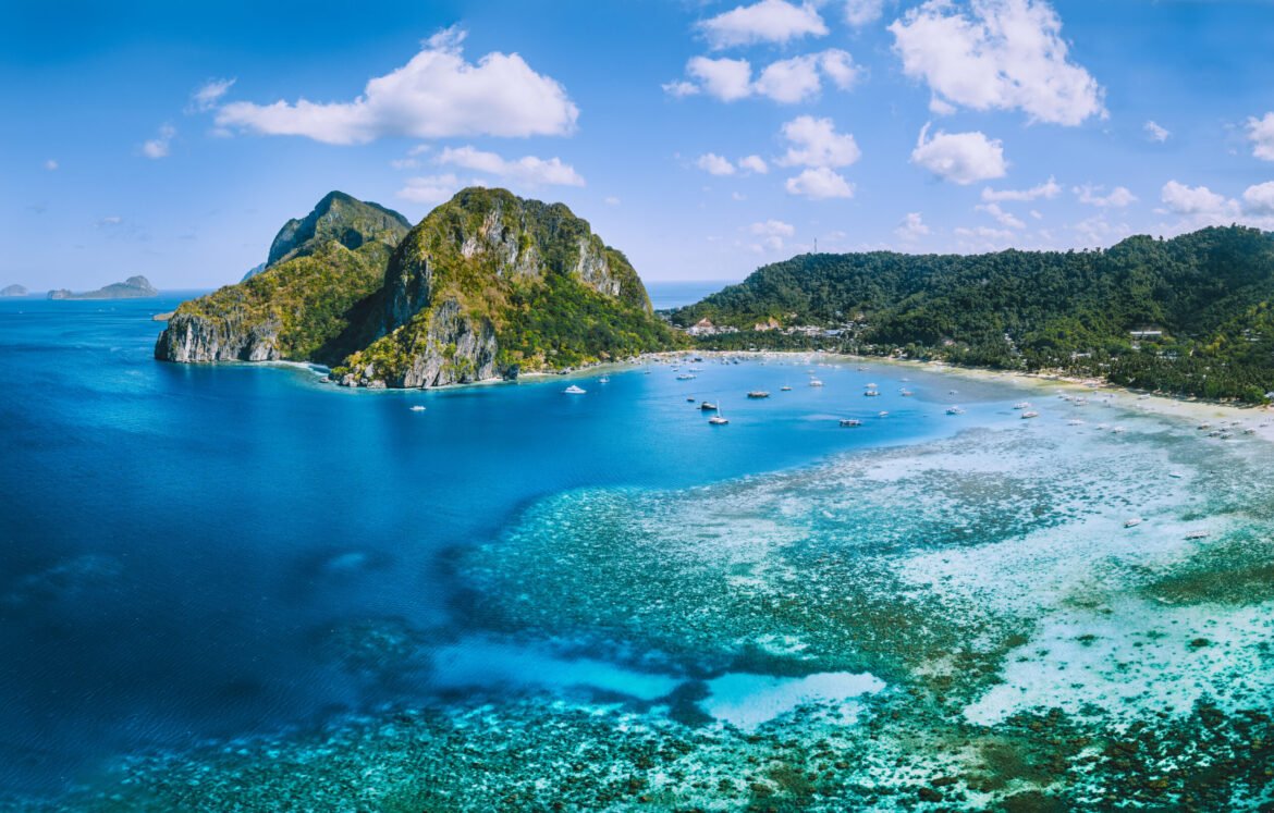 Aerial panoramic view of Corong Corong lagoon with moored boats. El Nido village, Palawan, Philippines.