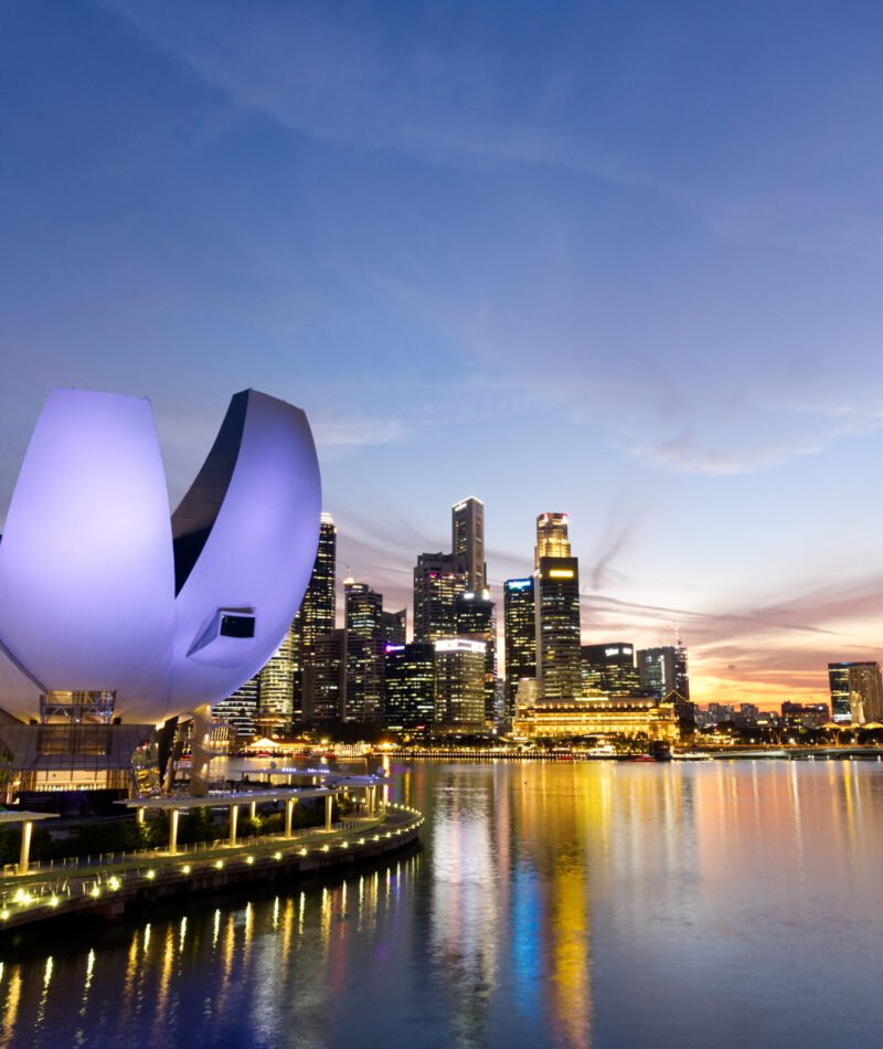 Merlion Park, Marina bay at Singapore - April 3rd,2019; City view and ArtScience Museum at evening twilight from The Helix bridge at Marina bay.