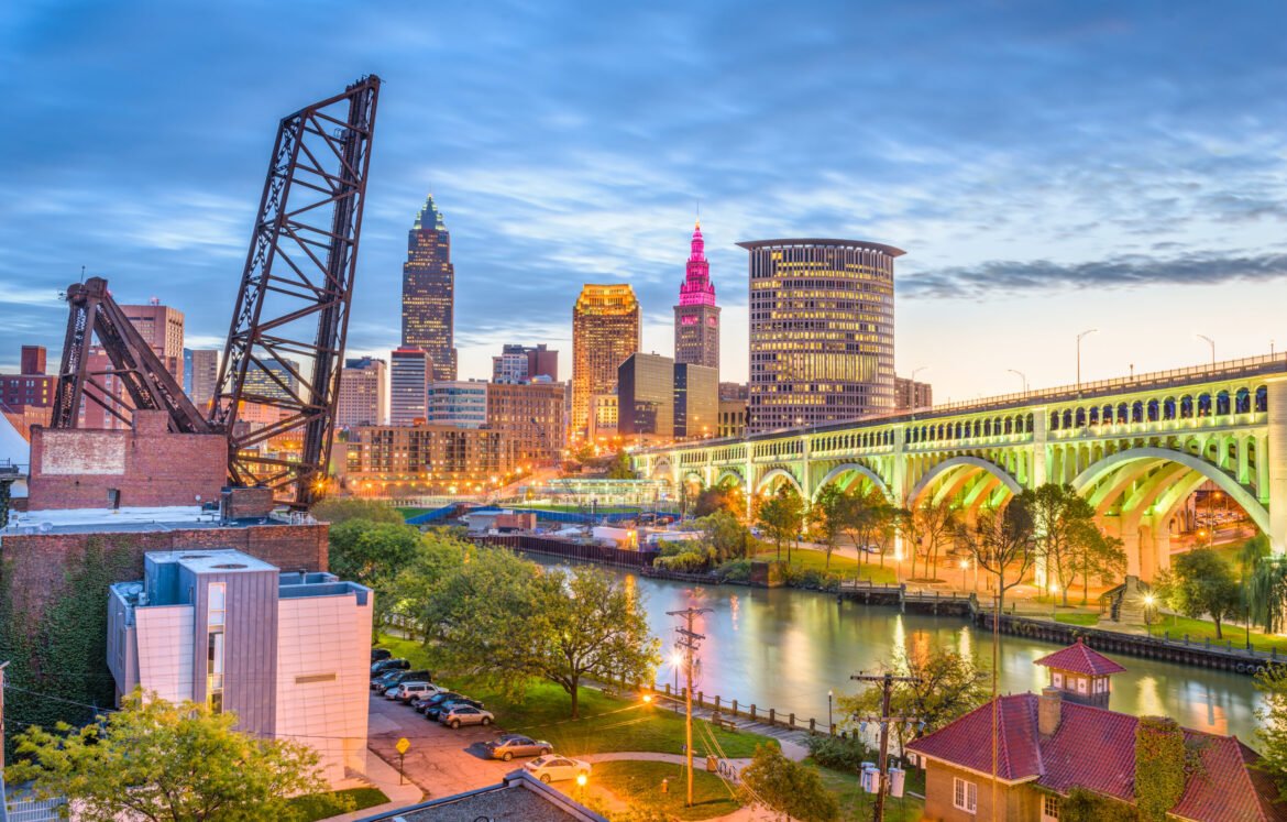 Cleveland, Ohio, USA city skyline over the Cuyahoga River.