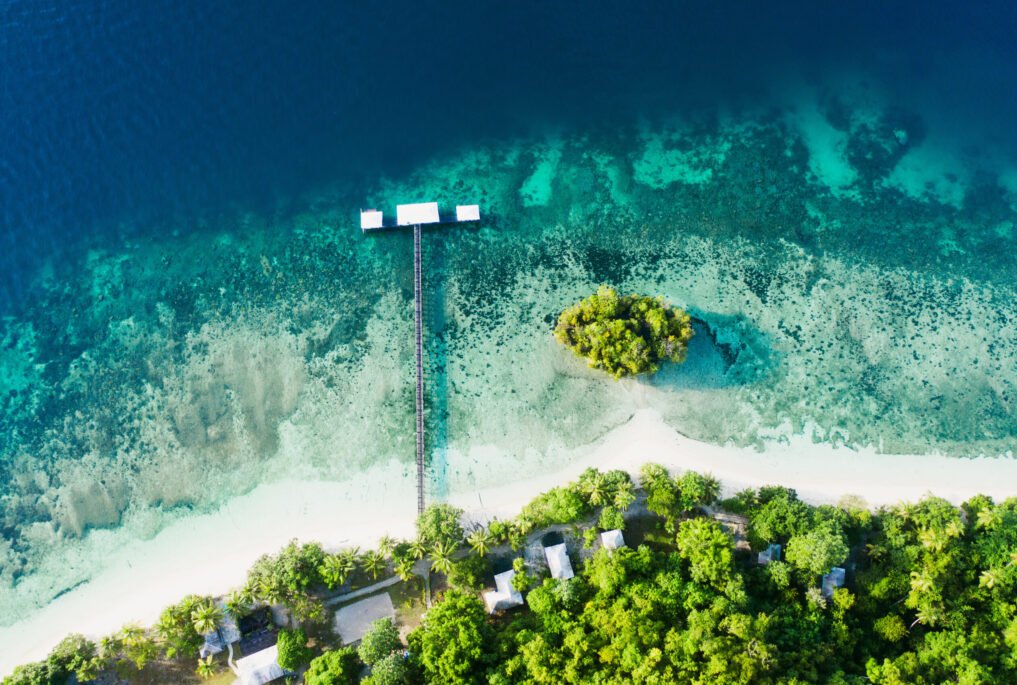 Its quiet on the coast. High angle shot of a clear blue ocean touching the coastline